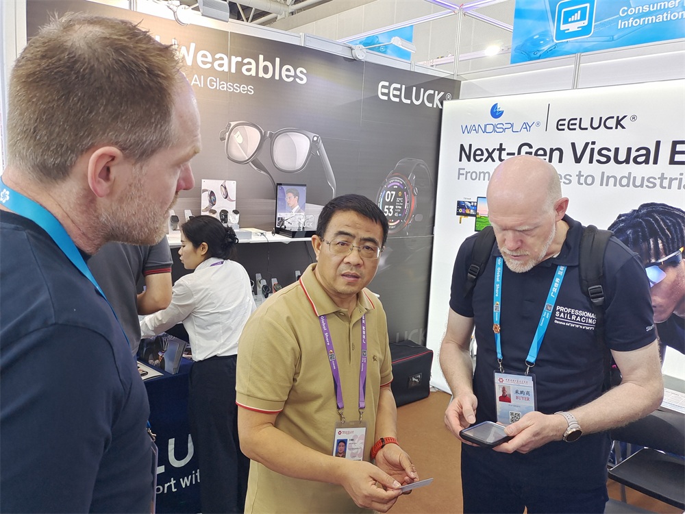 Buyers documenting smart watch product details for evaluation